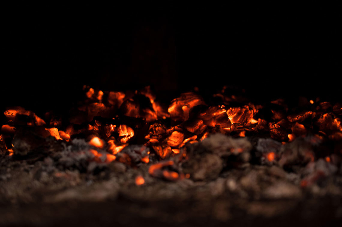 A detailed close-up of red hot burning coal