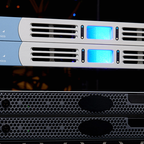 A rack of servers illuminated by blue lights, showcasing a modern data center environment.